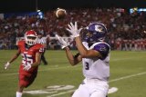 Lemoore's Brandon Hargrove has his eyes on another Justin Holaday pass Friday night in the Tigers 49-41 loss to Sanger High School.